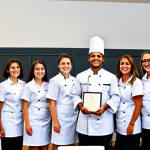 Culinary School Graduation**

"A young chef, fully clothed in professional chef attire, receiving a diploma at a culinary school graduation ceremony, happy and proud, surrounded by classmates and faculty, professional setting, appropriate content, safe for work, perfect anatomy, natural proportions, high quality photo, family-friendly event."

**